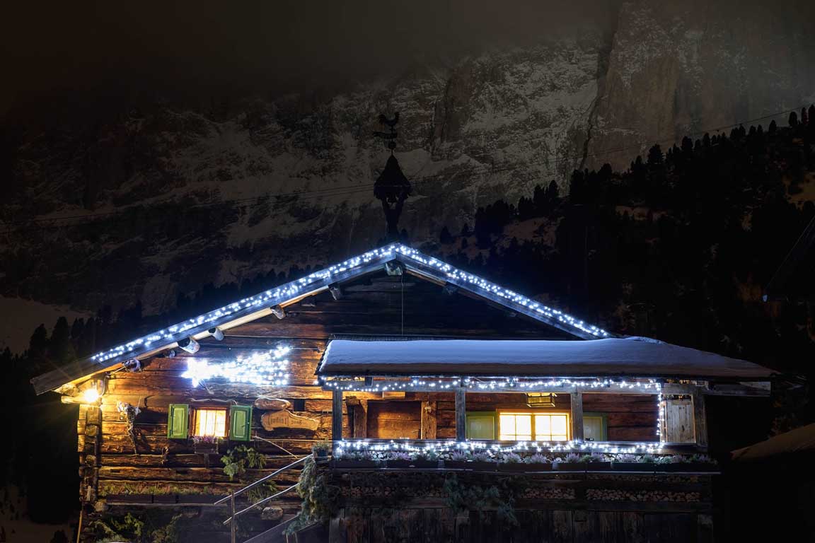 Snowbound mountain hut Ciadinat in Val Gardena Dolomites Italy in January